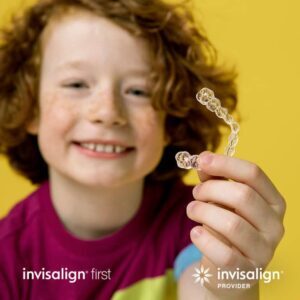 invisalign first kid holding invisalign