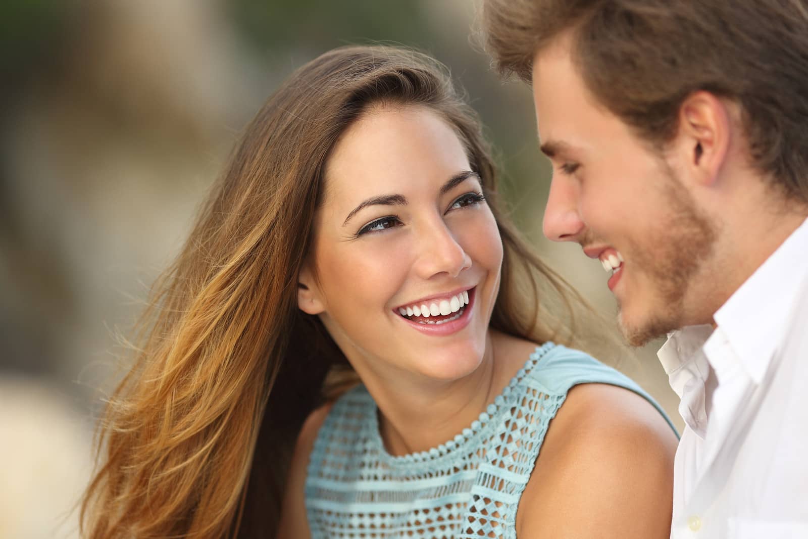 smiling couple with whitened teeth